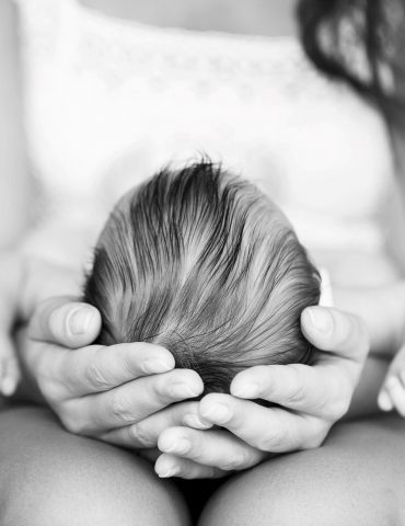 cradling baby's head bw_cropped